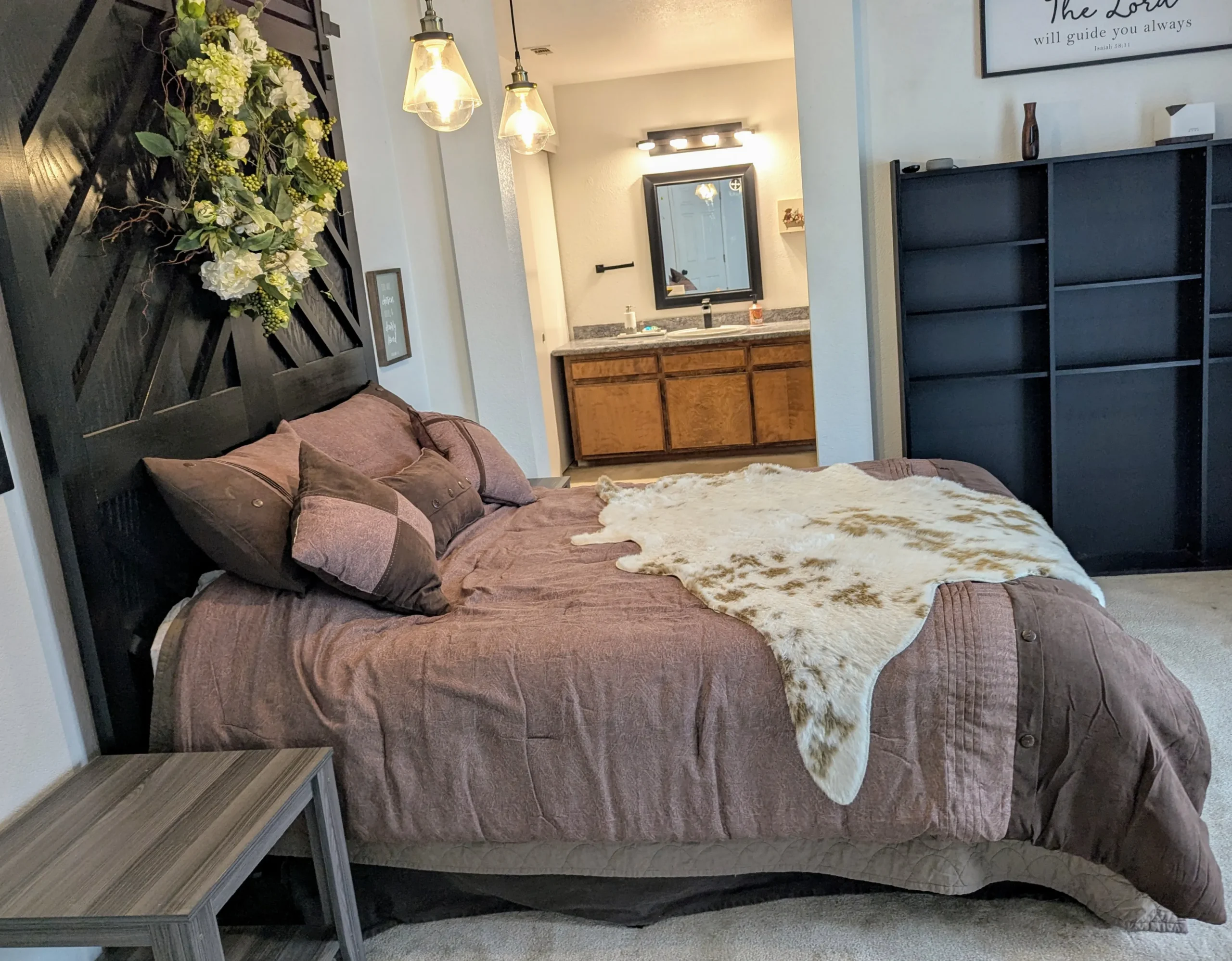 Interior of Diamond E Ranch's master suite, showcasing cozy decor and farm surroundings